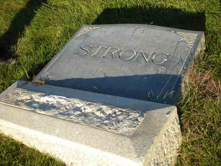 Broken Headstone of William Hill Strong and his Wife Clara Ann Bishop.